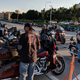 Harleys line the street in Milwaukee at the 115th anniversary celebration.